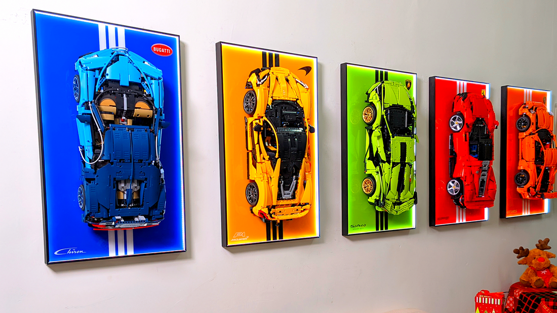 Wall display frames showcasing LEGO sports car models with colorful backgrounds