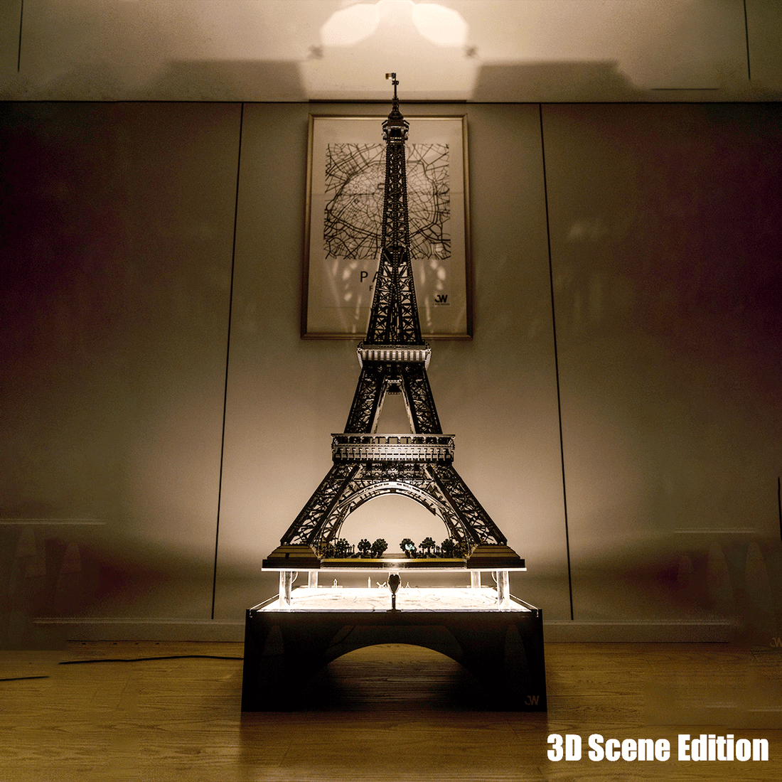Illuminated display case showcasing a LEGO Eiffel Tower model with a 3D scene base.