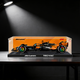 LEGO McLaren F1 car displayed in a clear acrylic wall display case with black base