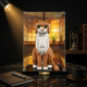 LEGO cat model displayed in clear acrylic frame on a marble desk with warm lighting
